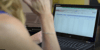 woman viewing the master key system in Securityrecords.com tracking software